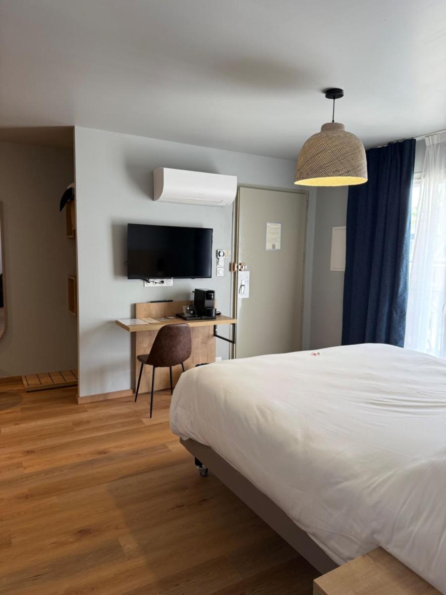 Télévision ou salle de divertissement dans l'établissement Tulip Inn Honfleur Residence & Spa