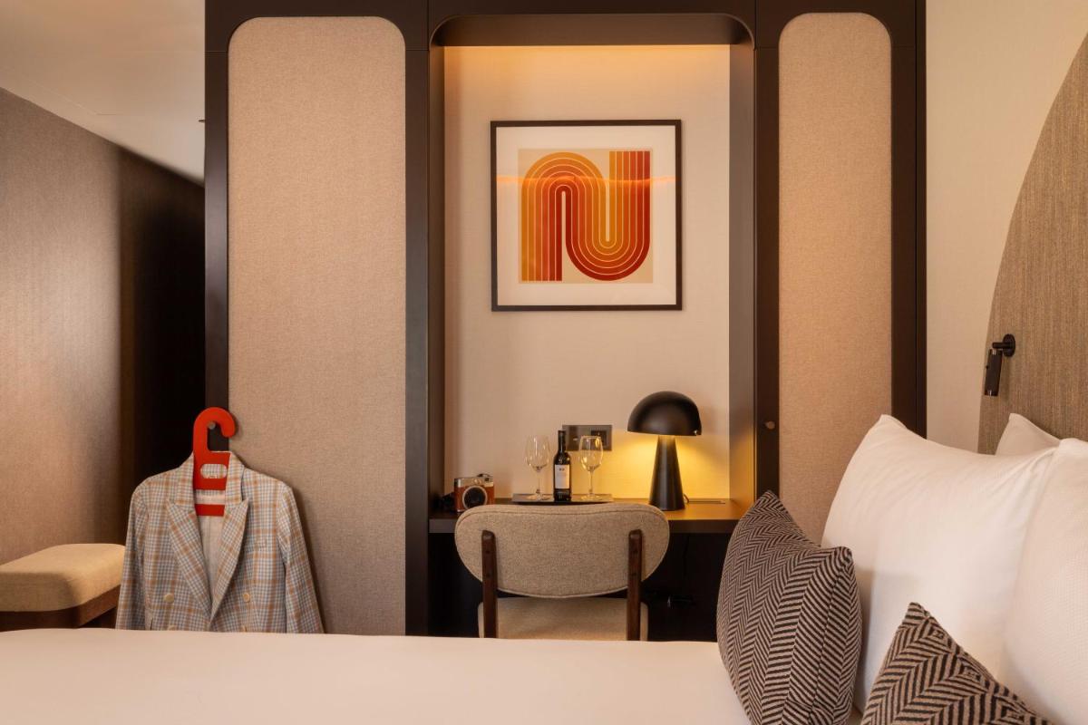 Un ou plusieurs lits dans un hébergement de l'établissement Belinda Hôtel & Spa