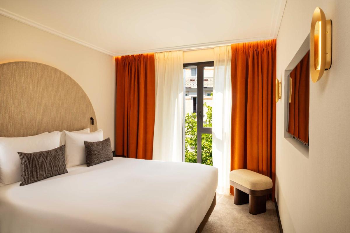 Un ou plusieurs lits dans un hébergement de l'établissement Belinda Hôtel & Spa