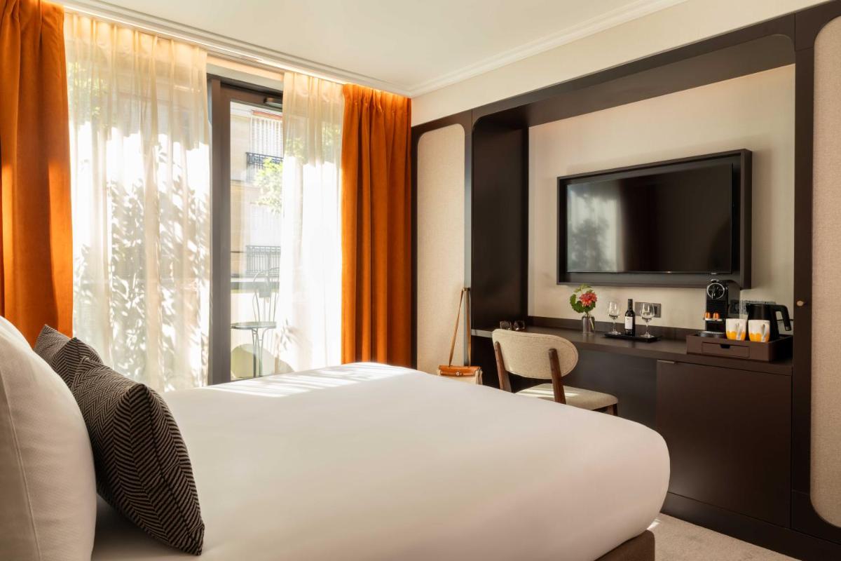 Un ou plusieurs lits dans un hébergement de l'établissement Belinda Hôtel & Spa
