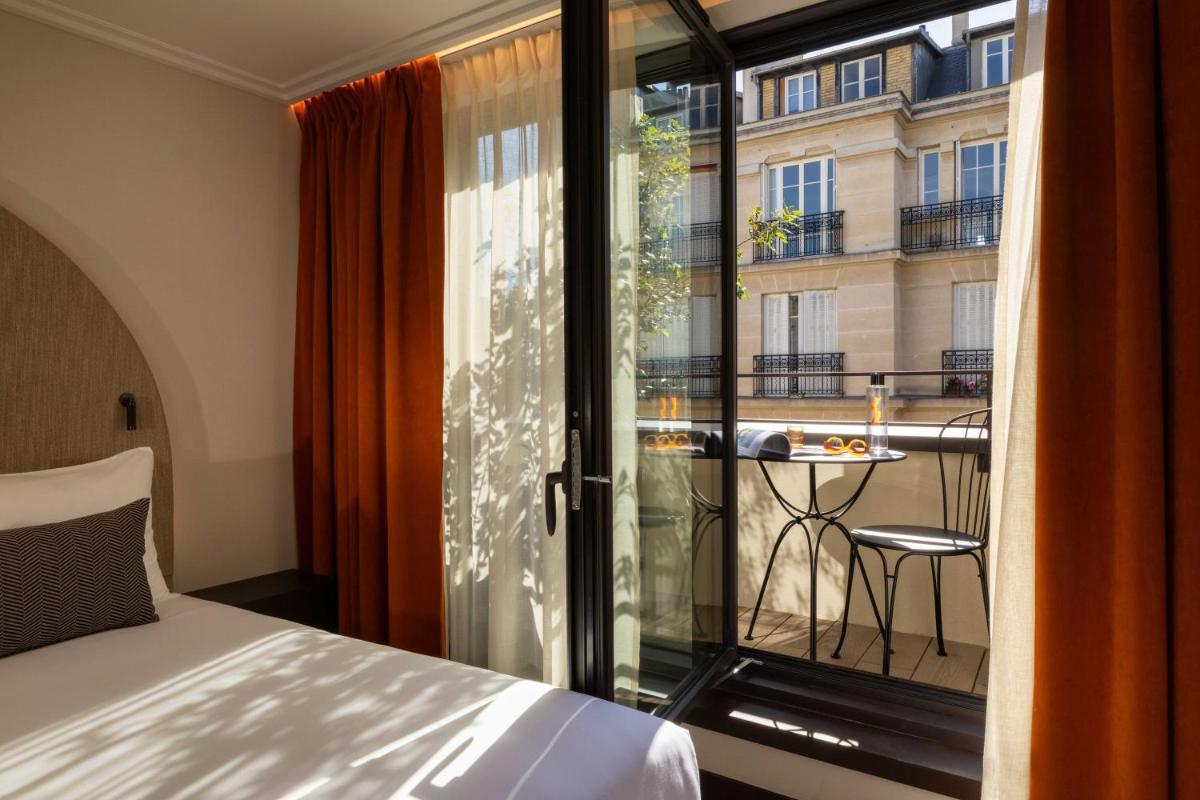 Un ou plusieurs lits dans un hébergement de l'établissement Belinda Hôtel & Spa