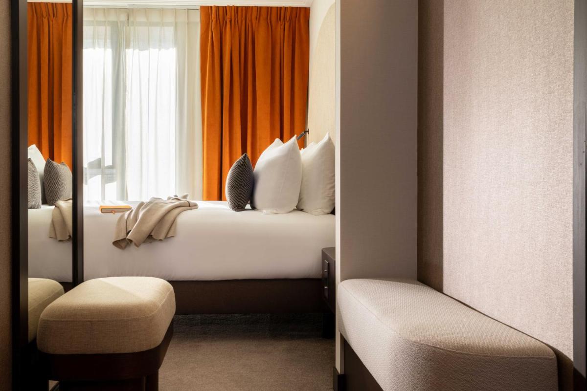 Un ou plusieurs lits dans un hébergement de l'établissement Belinda Hôtel & Spa