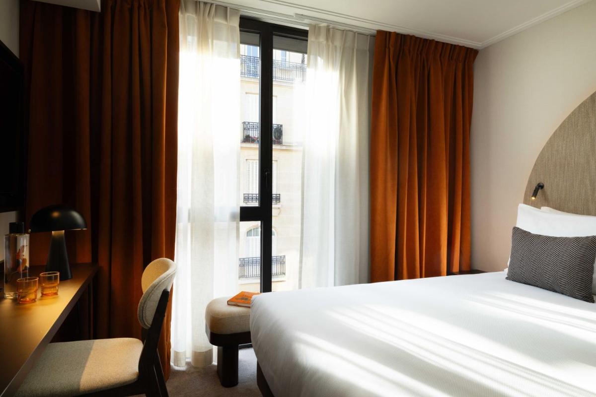 Un ou plusieurs lits dans un hébergement de l'établissement Belinda Hôtel & Spa