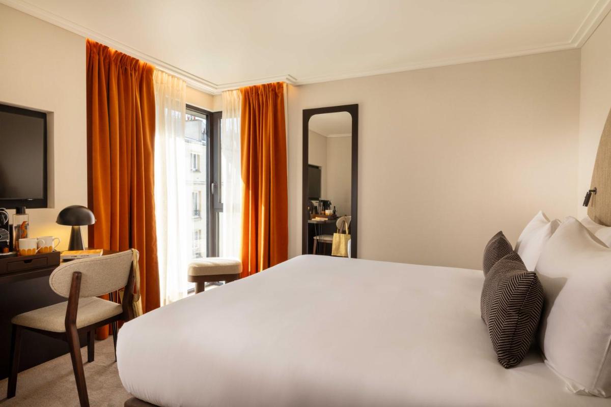 Un ou plusieurs lits dans un hébergement de l'établissement Belinda Hôtel & Spa