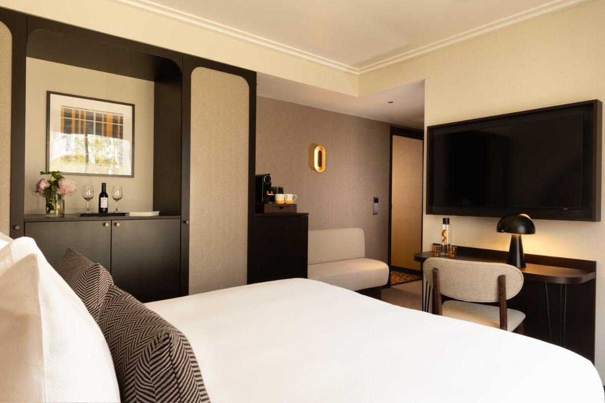 Un ou plusieurs lits dans un hébergement de l'établissement Belinda Hôtel & Spa