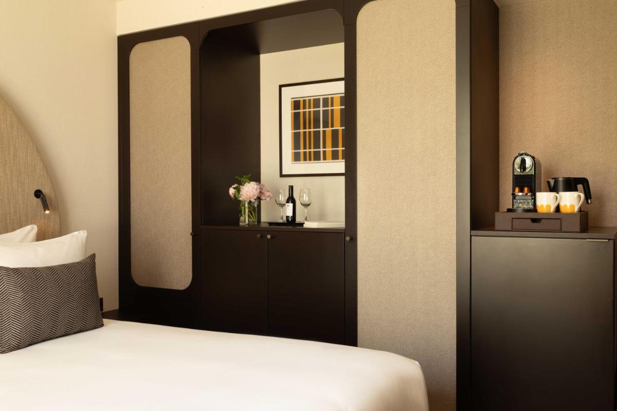 Un ou plusieurs lits dans un hébergement de l'établissement Belinda Hôtel & Spa