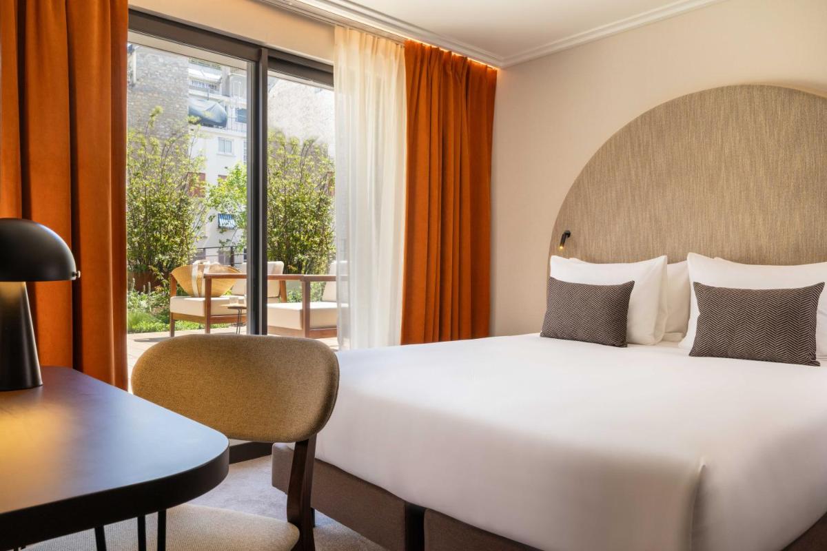 Un ou plusieurs lits dans un hébergement de l'établissement Belinda Hôtel & Spa