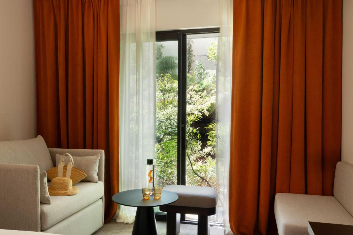 Coin salon dans l'établissement Belinda Hôtel & Spa