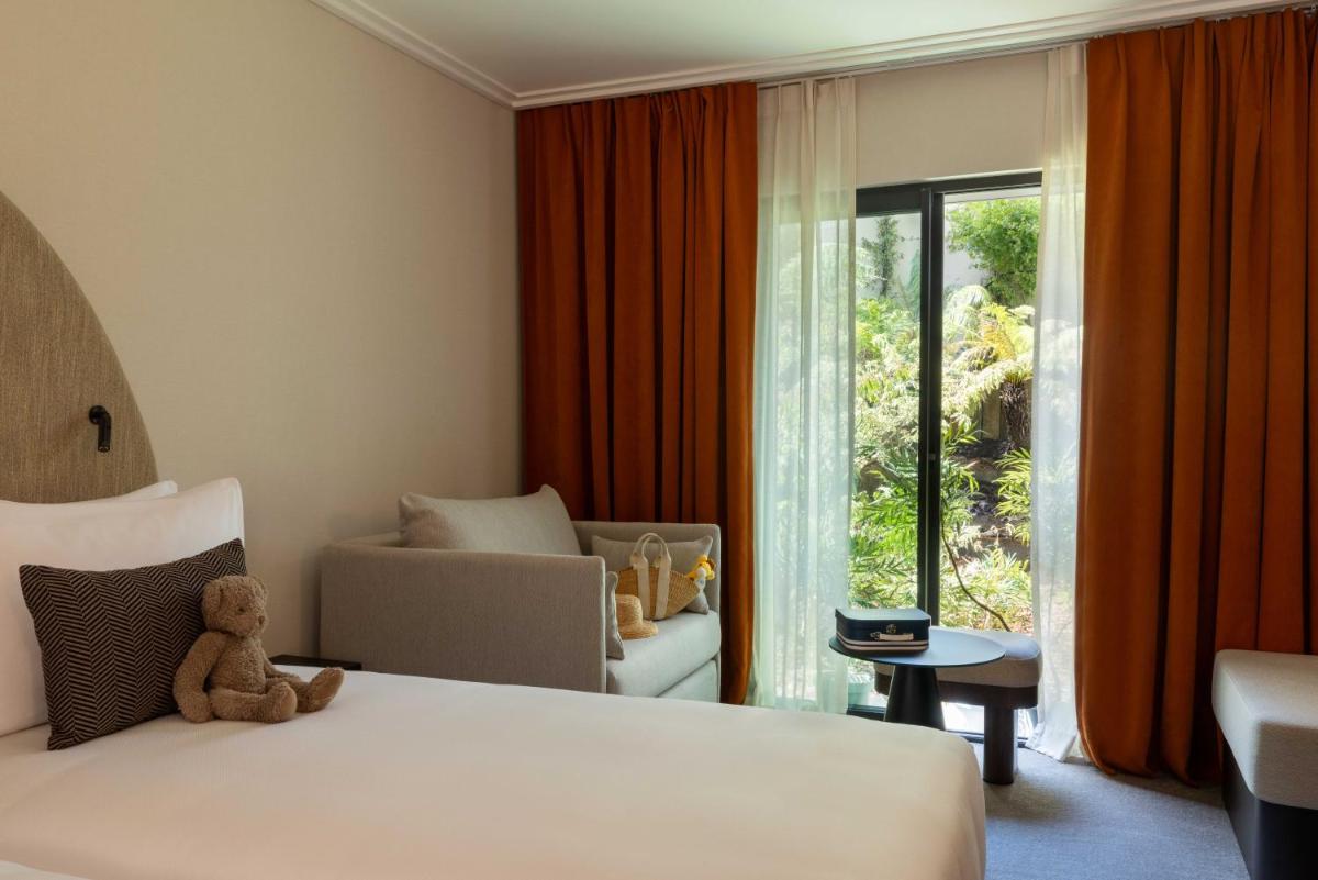 Un ou plusieurs lits dans un hébergement de l'établissement Belinda Hôtel & Spa