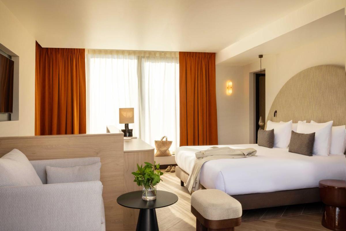Un ou plusieurs lits dans un hébergement de l'établissement Belinda Hôtel & Spa
