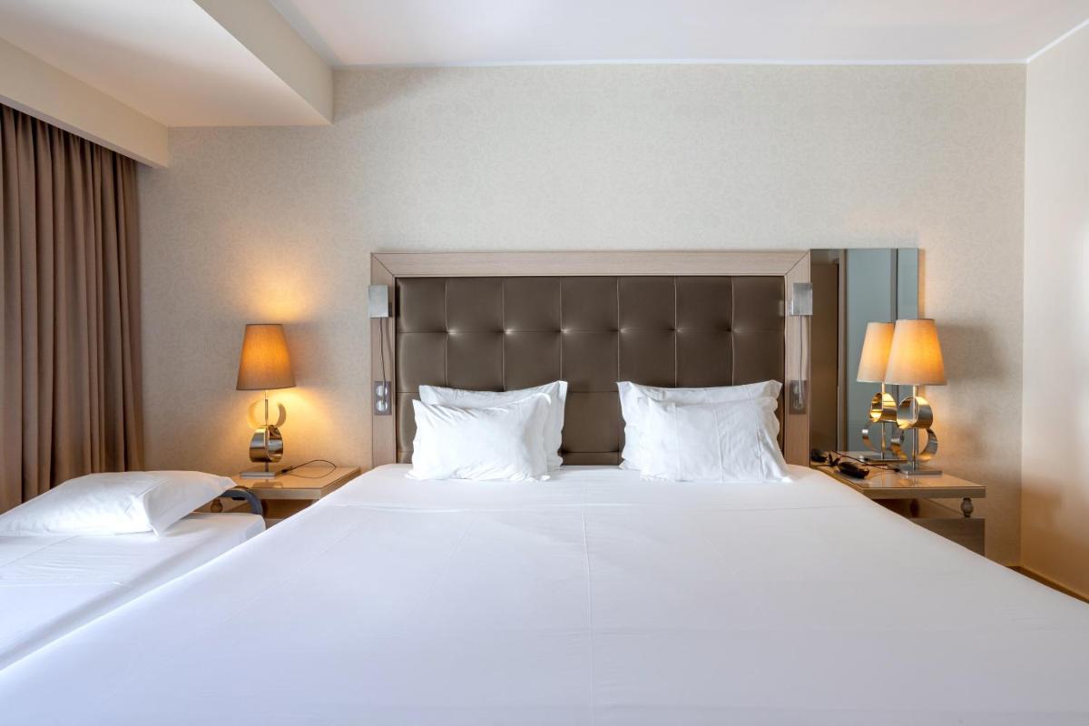 Uma cama ou camas num quarto em Hotel Porta do Sol Conference & SPA