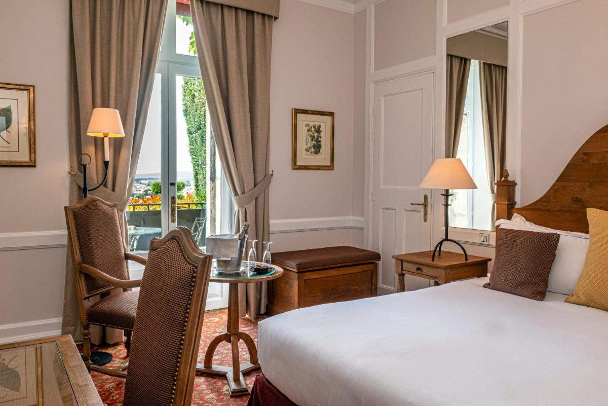 Un ou plusieurs lits dans un hébergement de l'établissement Hotel de la Cité Carcassonne - MGallery Collection