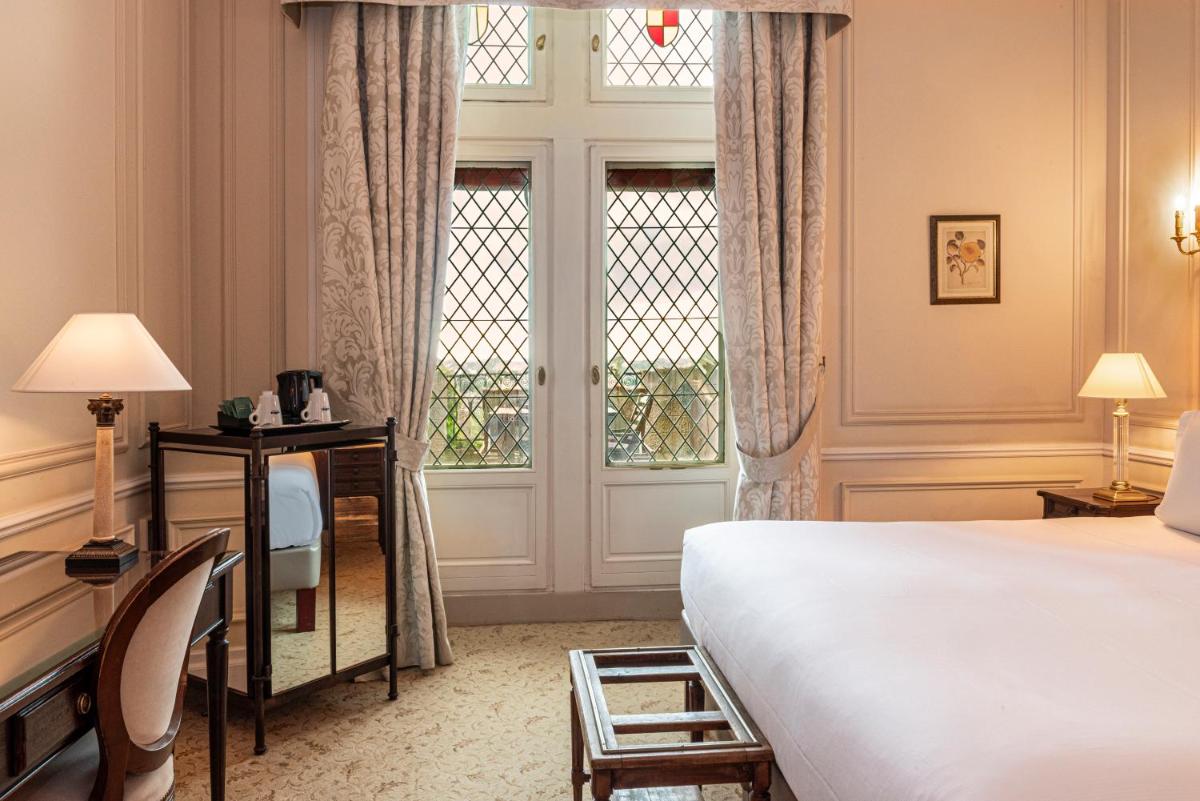 Un ou plusieurs lits dans un hébergement de l'établissement Hotel de la Cité Carcassonne - MGallery Collection
