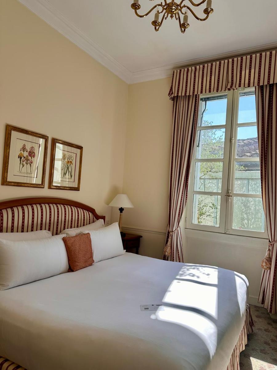 Un ou plusieurs lits dans un hébergement de l'établissement Hotel de la Cité Carcassonne - MGallery Collection