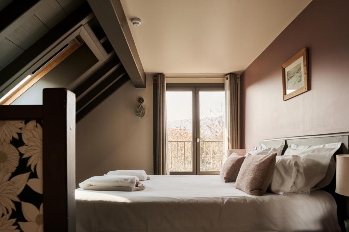 Un ou plusieurs lits dans un hébergement de l'établissement La Maison Rouge