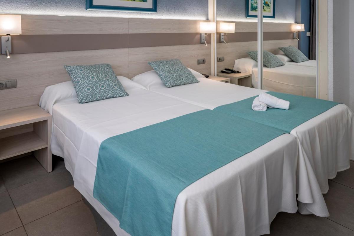Cama o camas de una habitación en 4R Salou Park Resort I