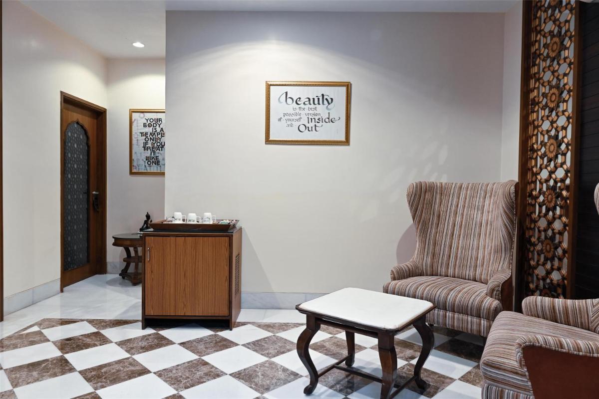 a waiting room with a chair and a table at Radisson Jodhpur in Jodhpur
