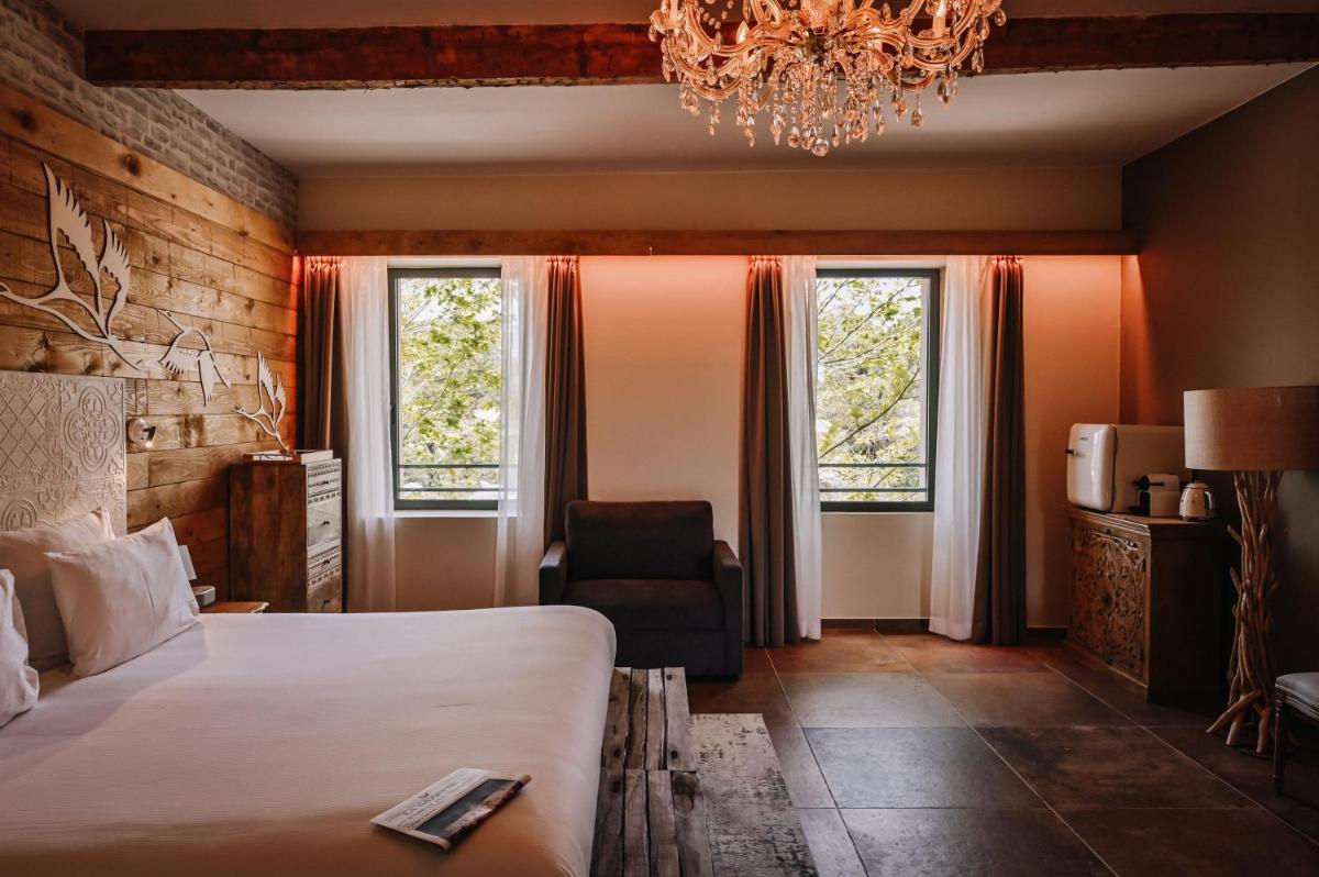 Un ou plusieurs lits dans un hébergement de l'établissement Le Hameau Des Pesquiers Ecolodge & Spa, Curio Collection By Hilton