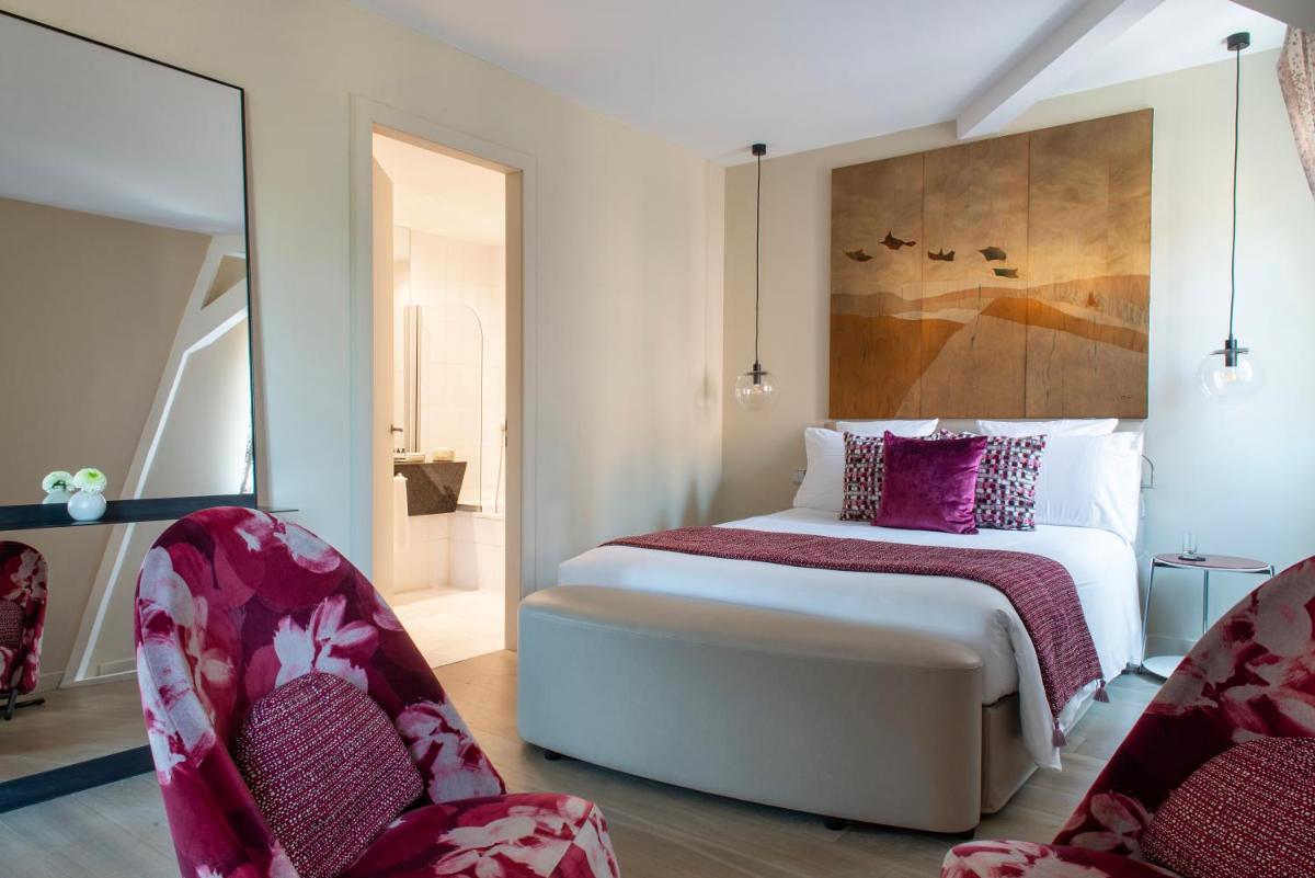 Un ou plusieurs lits dans un hébergement de l'établissement Hotel & Spa REGENT PETITE FRANCE