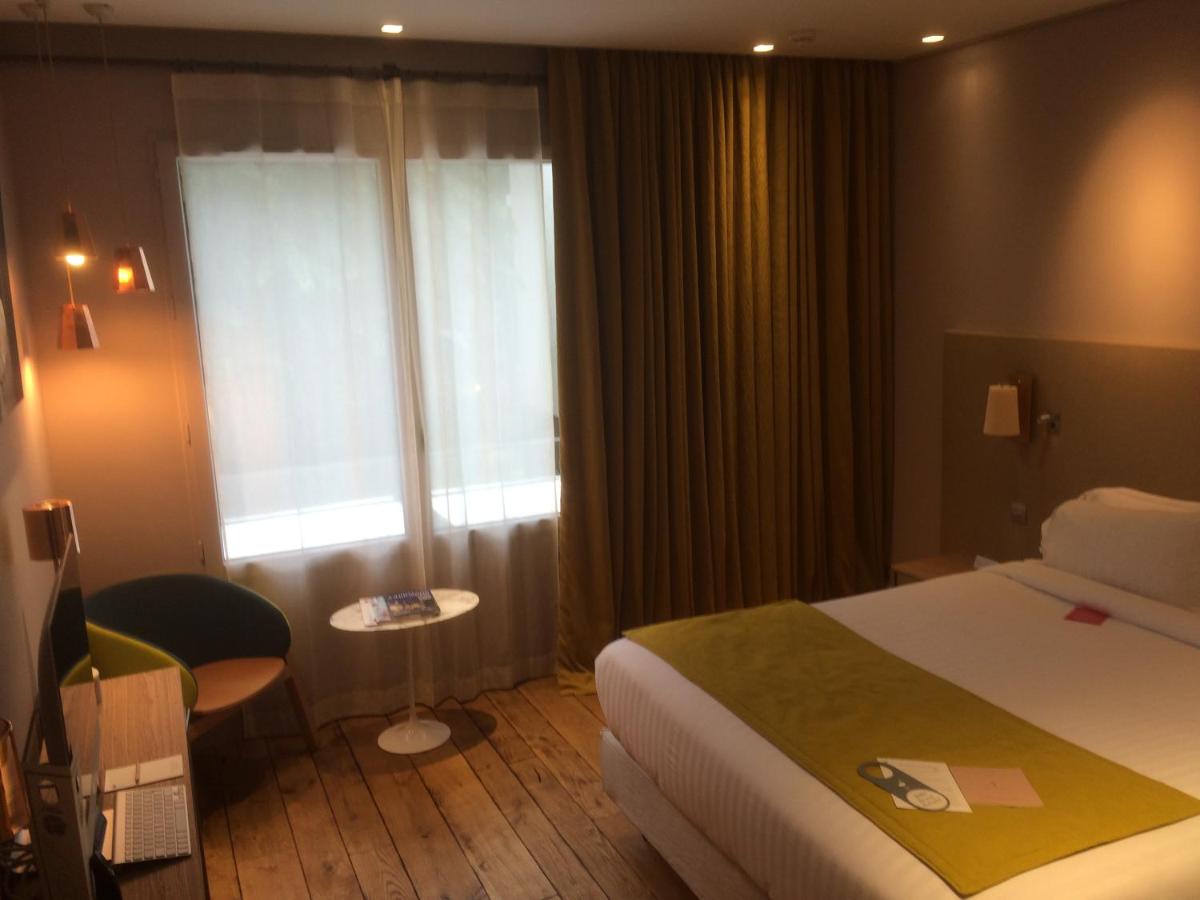 Un ou plusieurs lits dans un hébergement de l'établissement Hotel & Spa La Belle Juliette