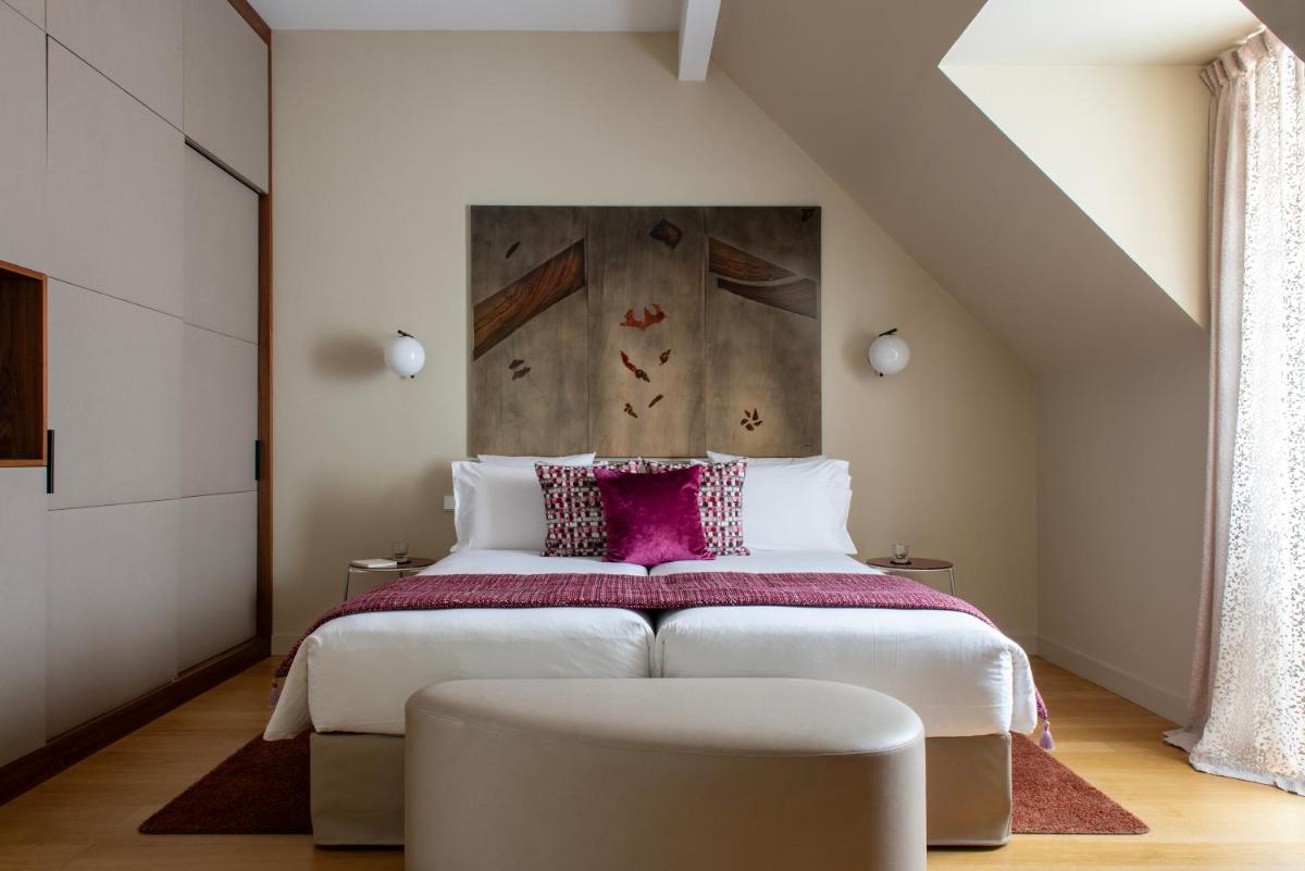 Un ou plusieurs lits dans un hébergement de l'établissement Hotel & Spa REGENT PETITE FRANCE