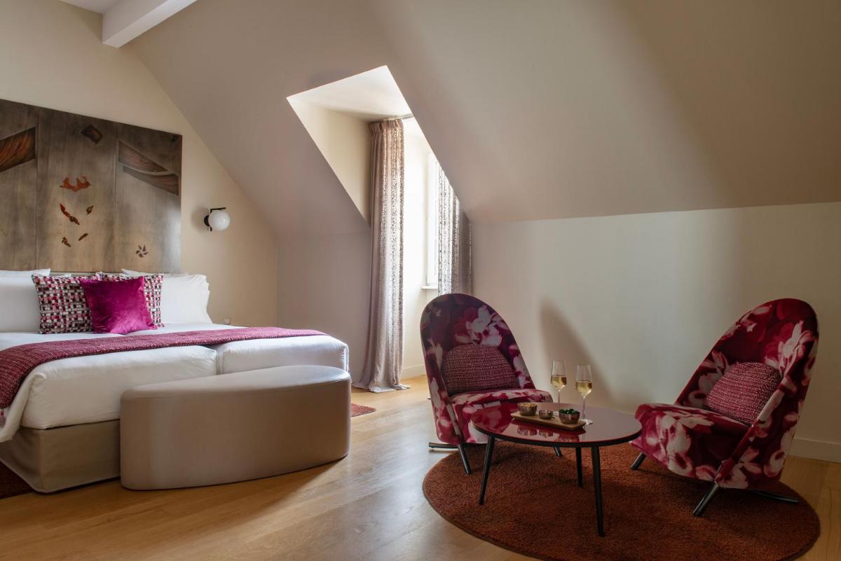 Un ou plusieurs lits dans un hébergement de l'établissement Hotel & Spa REGENT PETITE FRANCE
