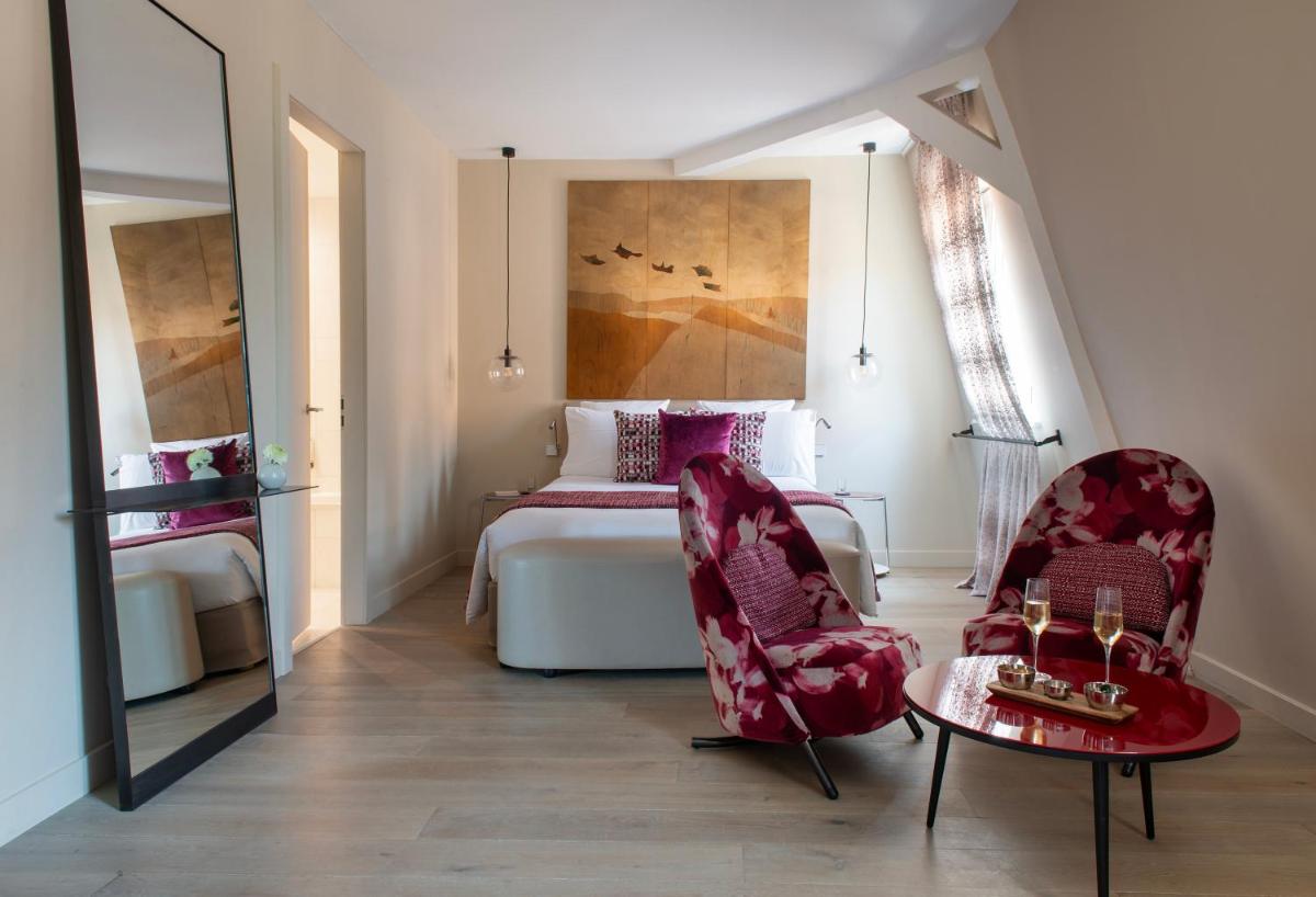 Un ou plusieurs lits dans un hébergement de l'établissement Hotel & Spa REGENT PETITE FRANCE