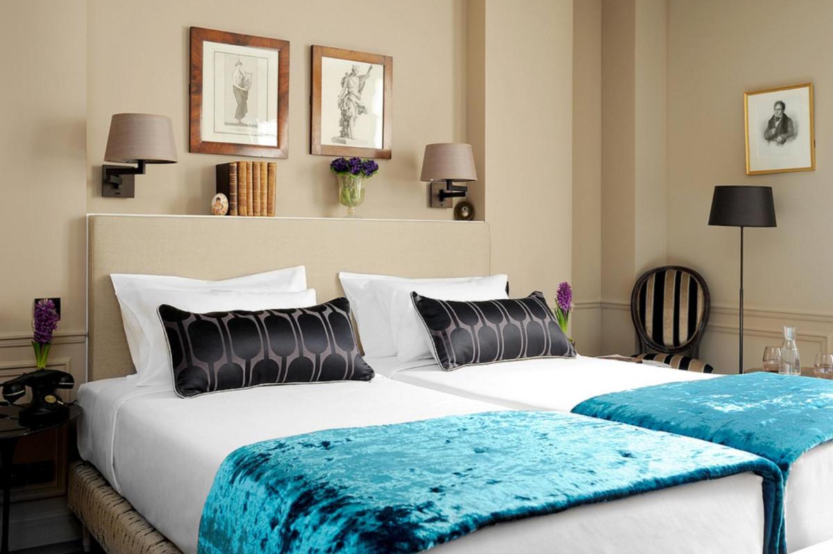 Un ou plusieurs lits dans un hébergement de l'établissement Hotel & Spa La Belle Juliette