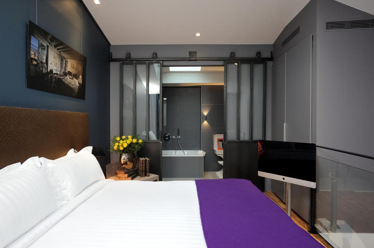 Un ou plusieurs lits dans un hébergement de l'établissement Hotel & Spa La Belle Juliette
