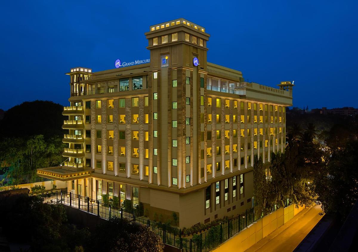 a building with a clock tower on top of it at Grand Mercure Mysore - An Accor Brand in Mysore
