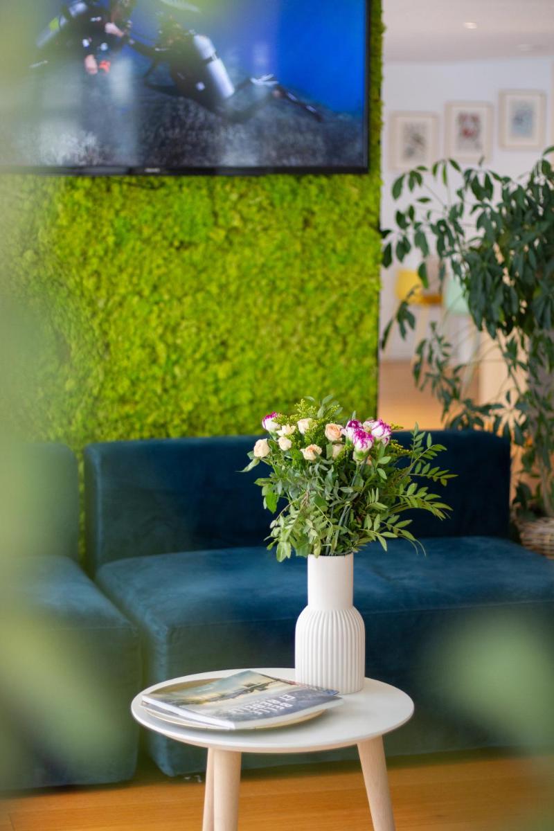 Télévision ou salle de divertissement dans l'établissement ATHOME RESIDENCE ET SPA