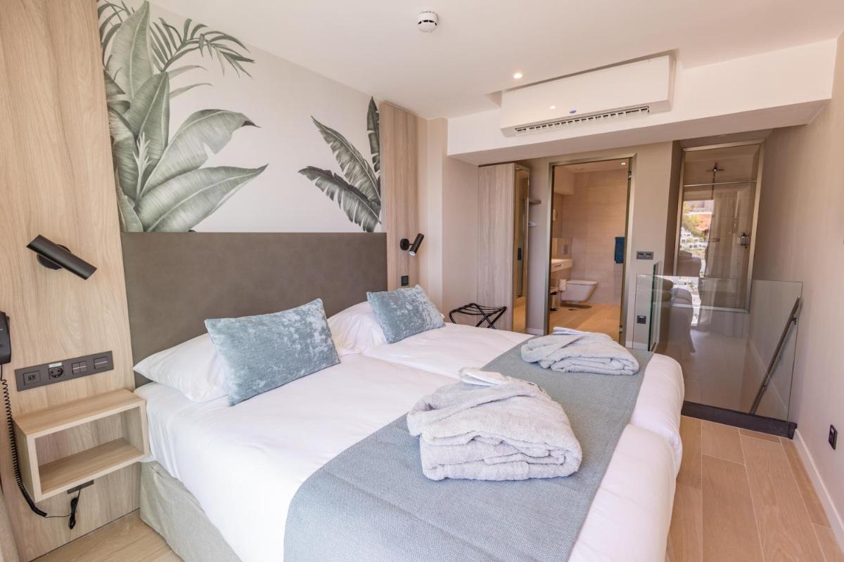 Cama o camas de una habitación en Servatur Puerto Azul
