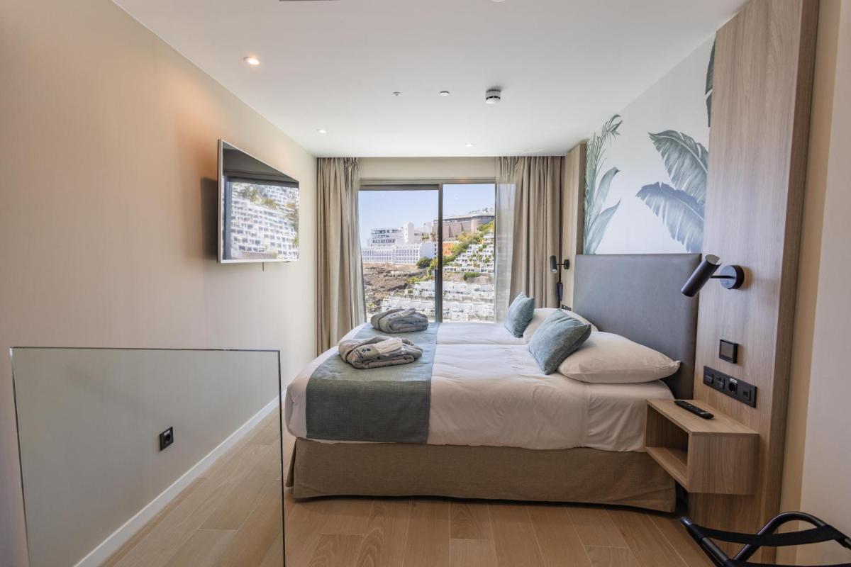 Cama o camas de una habitación en Servatur Puerto Azul