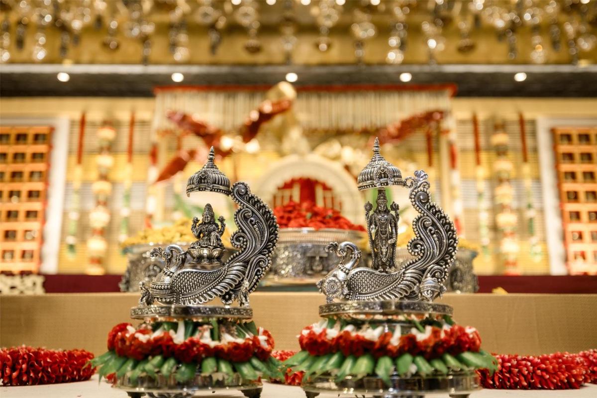 a pair of silver items sitting on a table at Radisson Blu Hotel & Suites GRT Chennai in Chennai