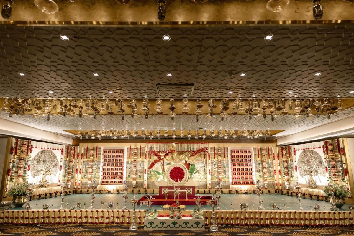 a stage in a building with christmas decorations at Radisson Blu Hotel & Suites GRT Chennai in Chennai