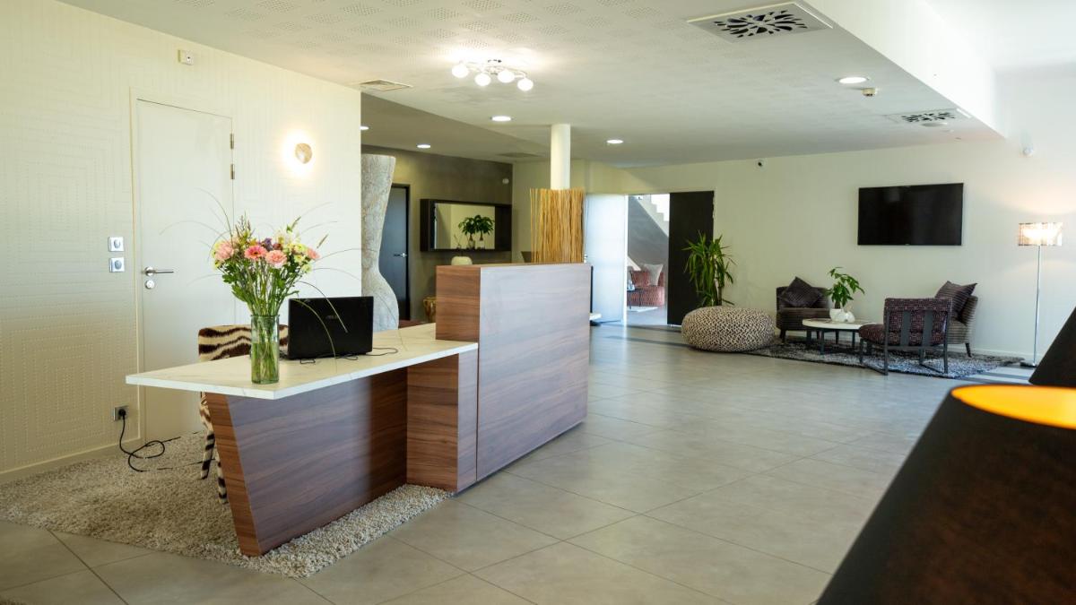 Télévision ou salle de divertissement dans l'établissement Les Villas du Parc de la Chabotterie