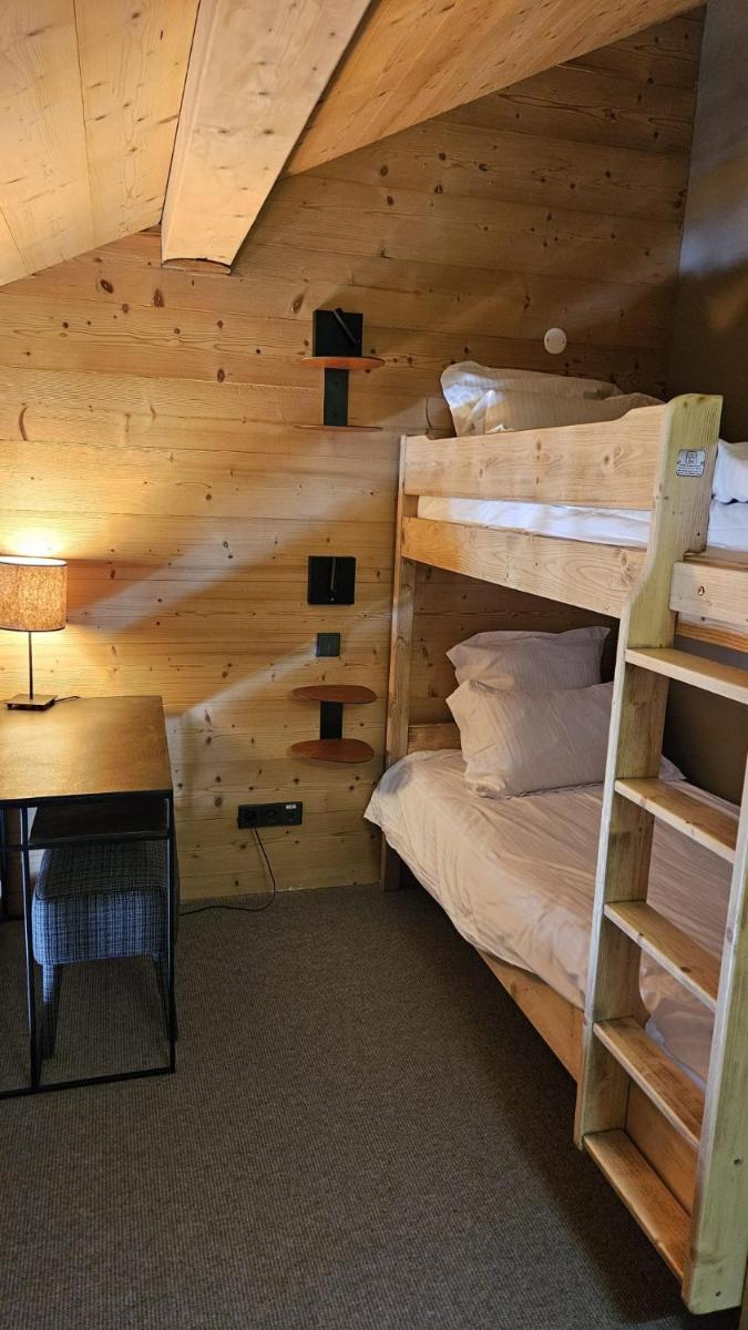 Un ou plusieurs lits superposés dans un hébergement de l'établissement Le Chalet Blanc Hôtel & Spa