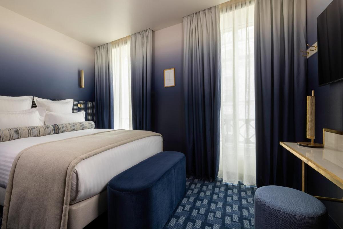 Un ou plusieurs lits dans un hébergement de l'établissement Hôtel Filigrane & Spa