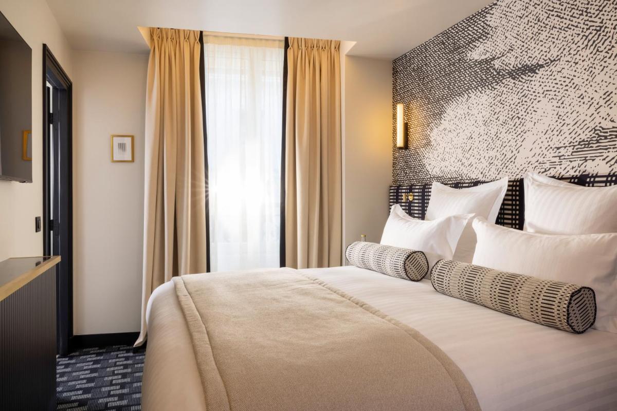 Un ou plusieurs lits dans un hébergement de l'établissement Hôtel Filigrane & Spa