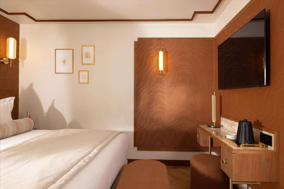 Télévision ou salle de divertissement dans l'établissement Hôtel Filigrane & Spa