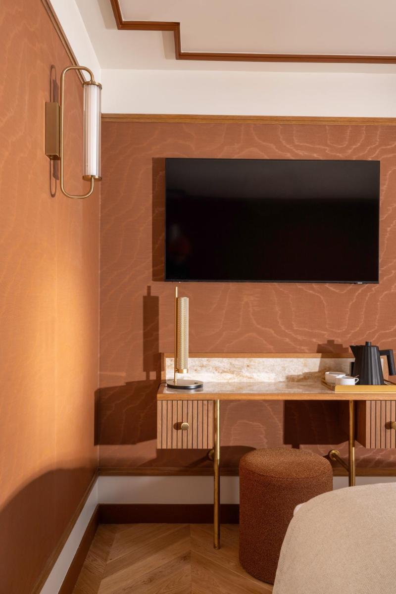 Télévision ou salle de divertissement dans l'établissement Hôtel Filigrane & Spa