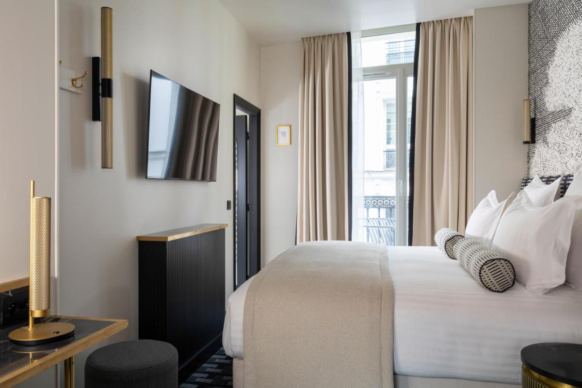 Un ou plusieurs lits dans un hébergement de l'établissement Hôtel Filigrane & Spa
