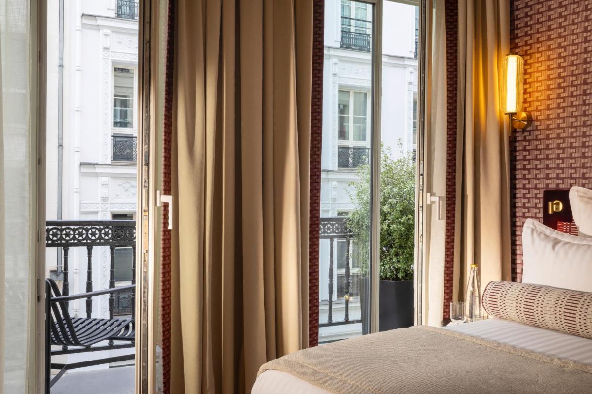 Un ou plusieurs lits dans un hébergement de l'établissement Hôtel Filigrane & Spa