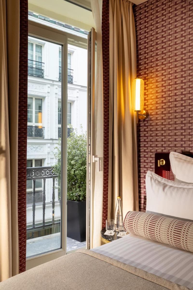 Un ou plusieurs lits dans un hébergement de l'établissement Hôtel Filigrane & Spa