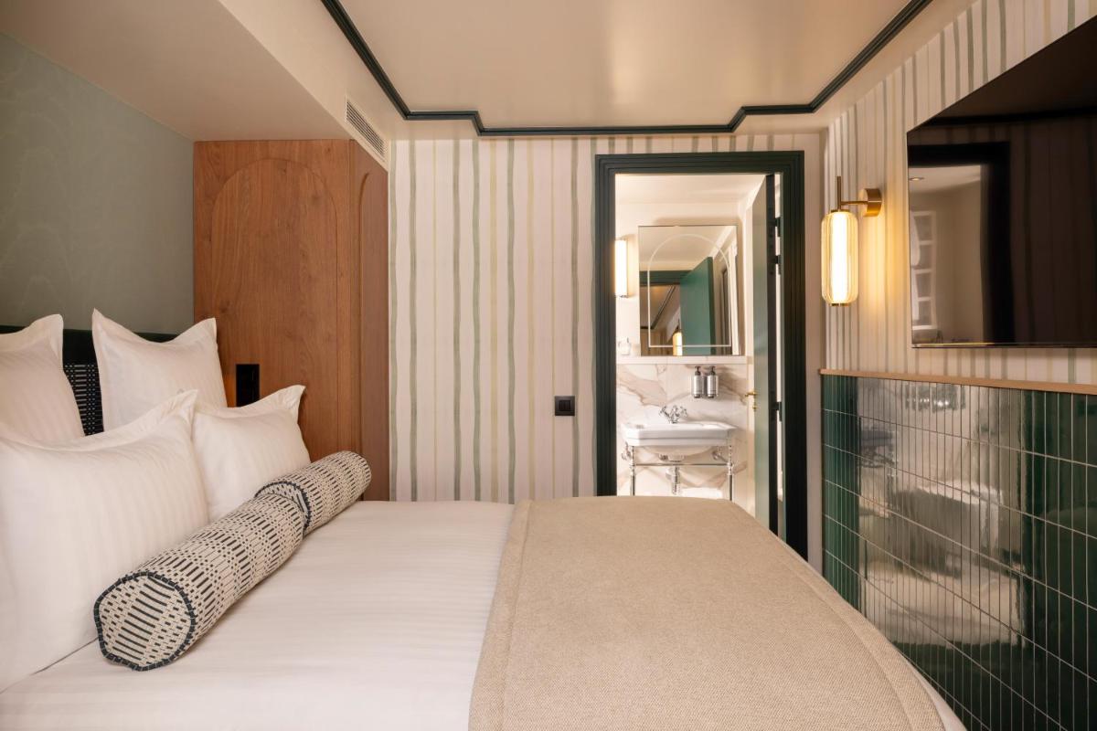 Un ou plusieurs lits dans un hébergement de l'établissement Hôtel Filigrane & Spa