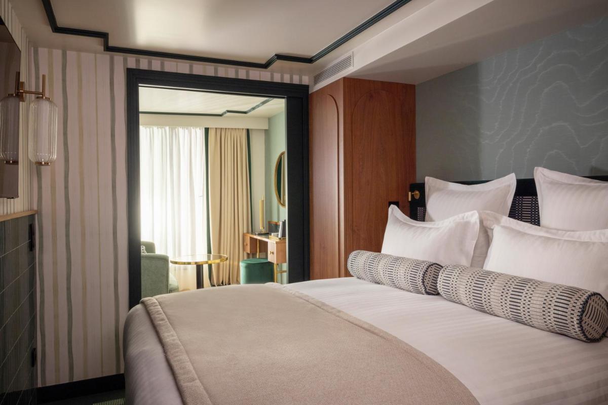 Un ou plusieurs lits dans un hébergement de l'établissement Hôtel Filigrane & Spa
