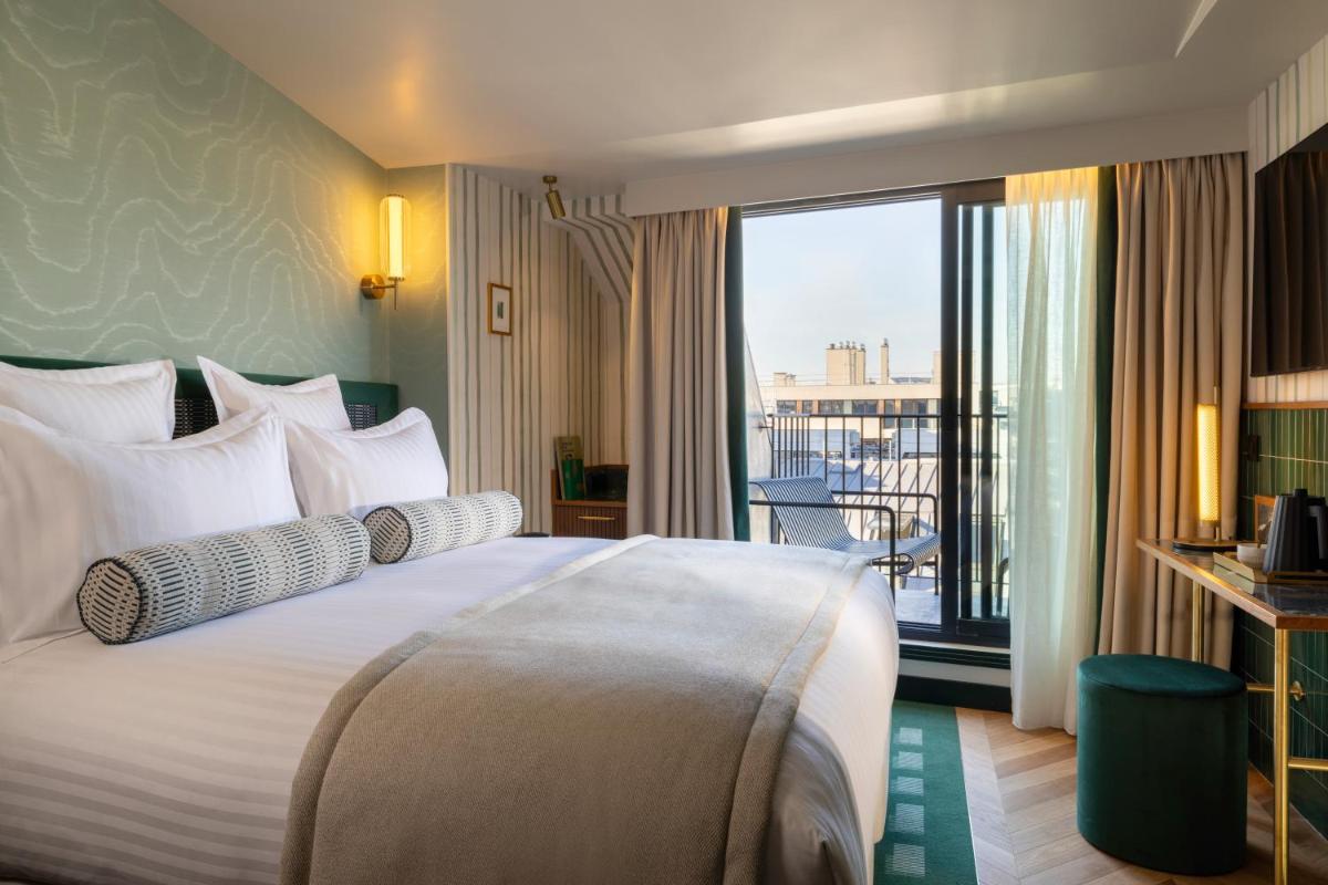 Un ou plusieurs lits dans un hébergement de l'établissement Hôtel Filigrane & Spa