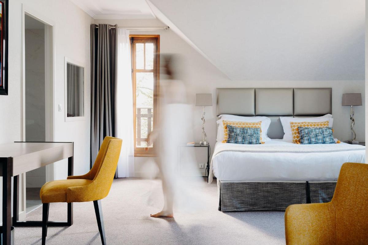Un ou plusieurs lits dans un hébergement de l'établissement Hotel Le Cottage Bise
