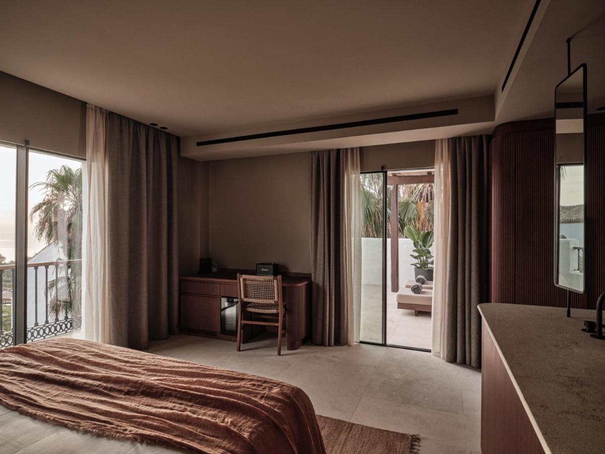 Cama o camas de una habitación en OKU Andalusia