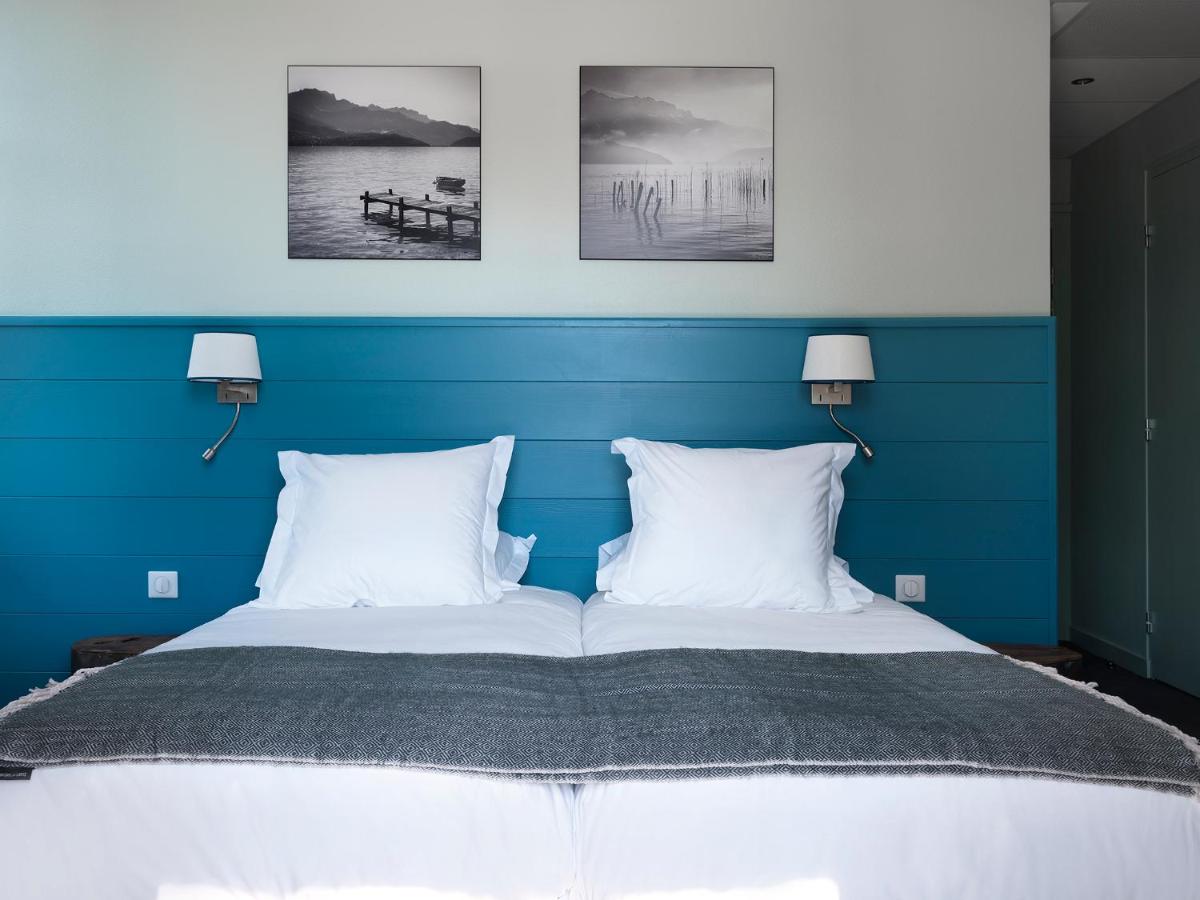 Un ou plusieurs lits dans un hébergement de l'établissement Hôtel Beau Site Talloires B SPA